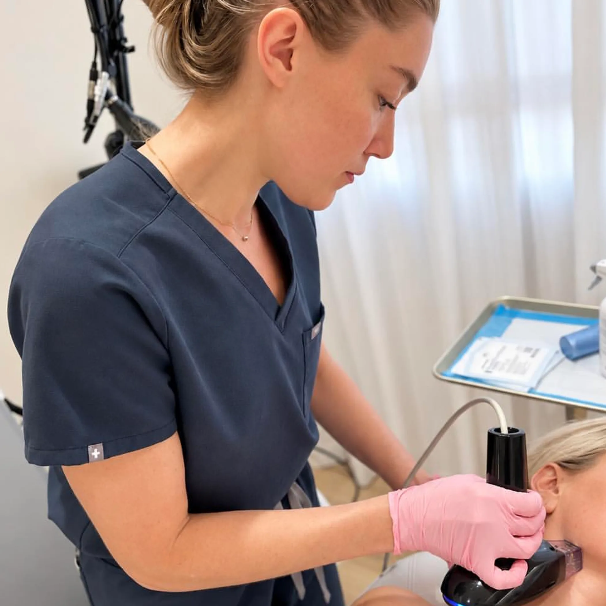 practitioner performing jawline aesthetics procedure