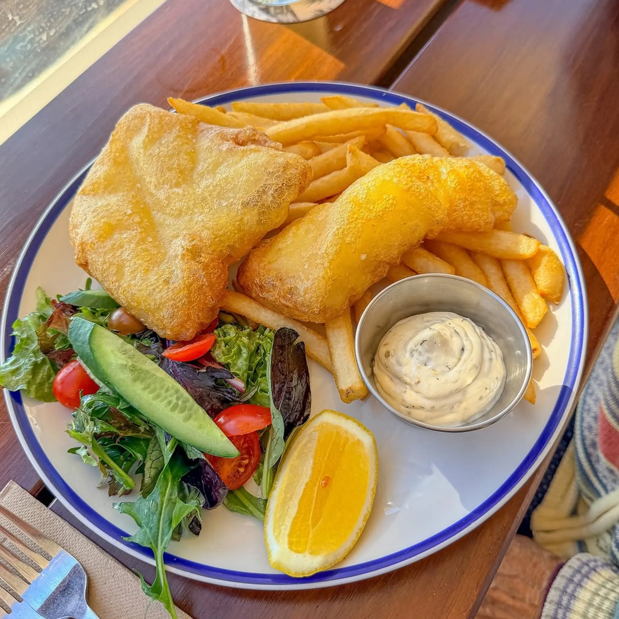 fish and chips with salad and sauce